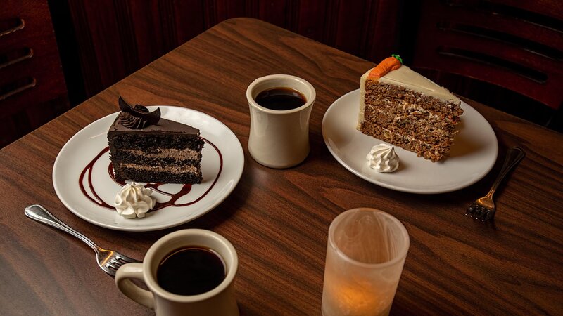 Cake desserts with mugs of coffee